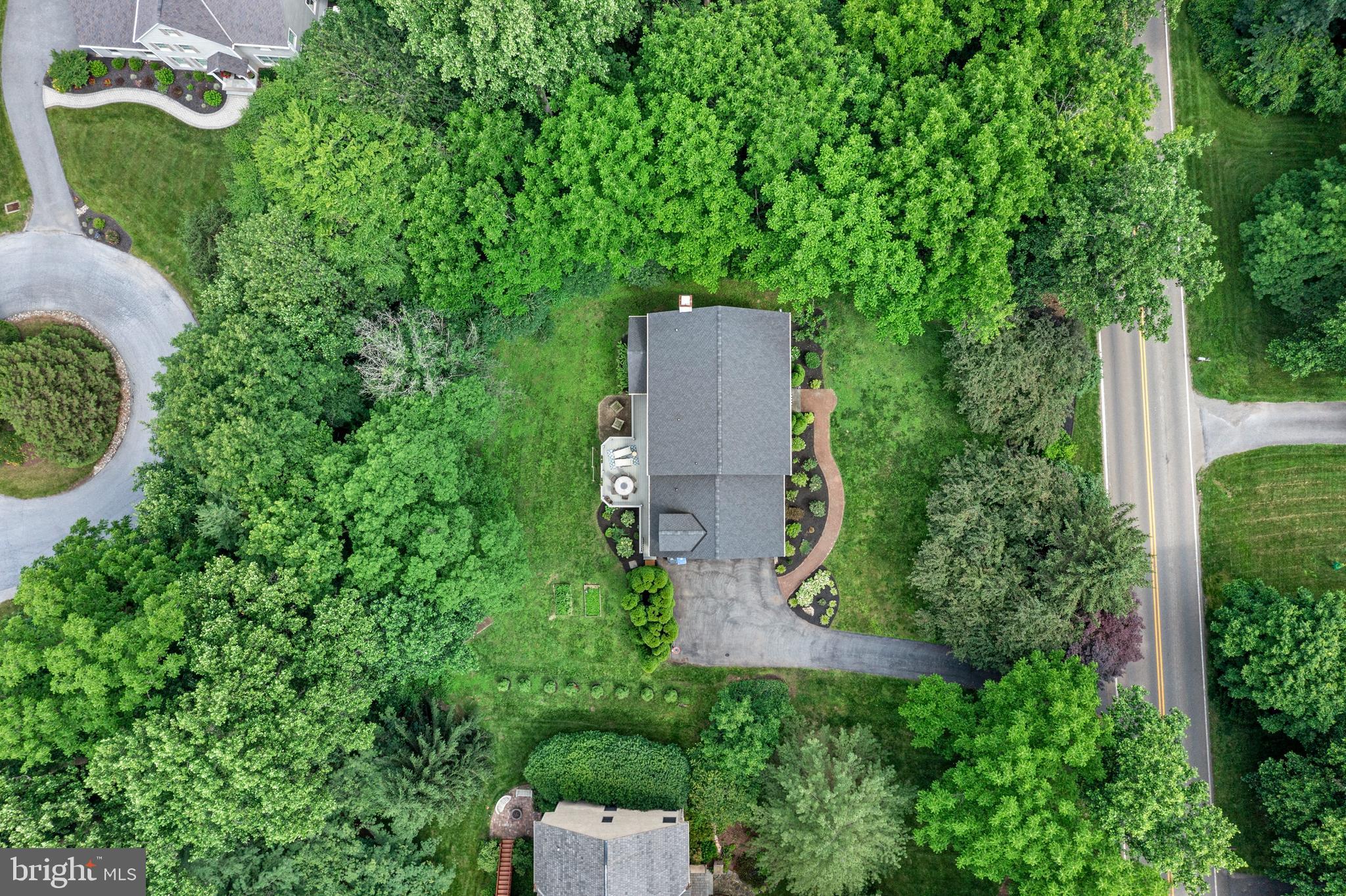 427 Buttonwood Road Landenberg, PA 19350 - Photo 69 of 82 an aerial view of a house with a yard and trees all around