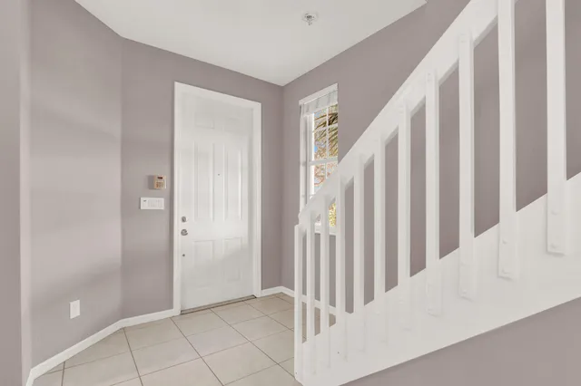 a view of a hallway with entryway door