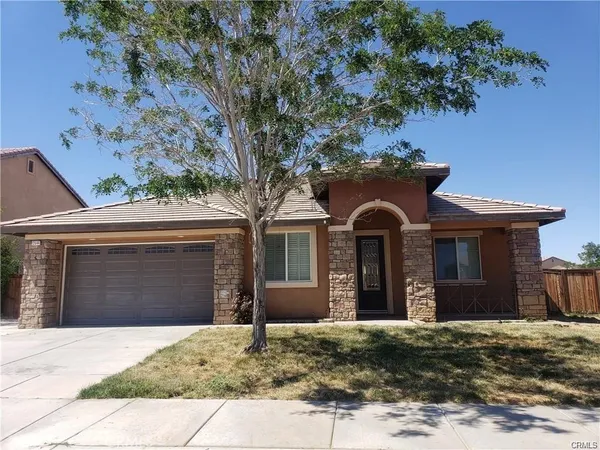a front view of a house with yard