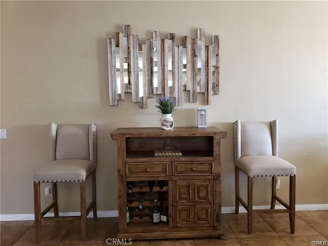 a living room with furniture a lamp and a fireplace