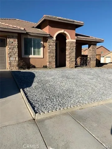 a front view of a house with parking