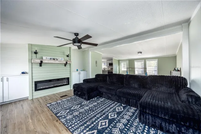 a view of a workspace with furniture and gym equipment