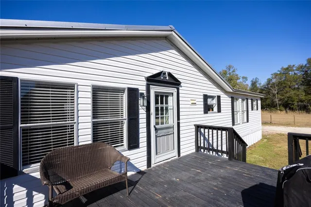 a front view of a house with wooden floor