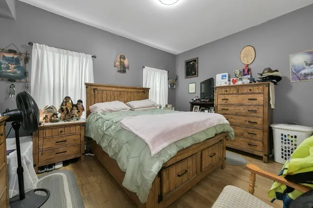 a bed room with a bed and a desk