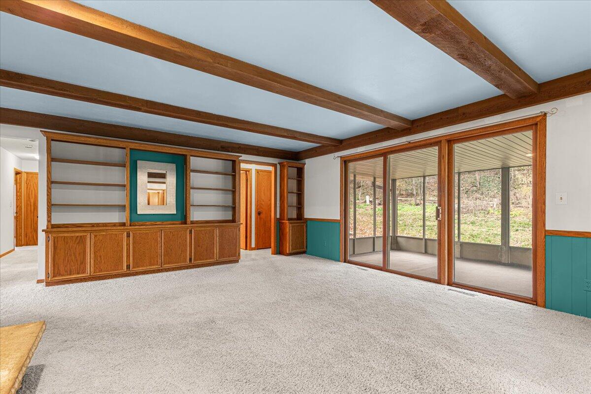 7525 North Redwood Road Glendale, WI 53209 - Photo 12 of 29 FmlyRm w/Built-Ins & Doors to 3-SeasonRm