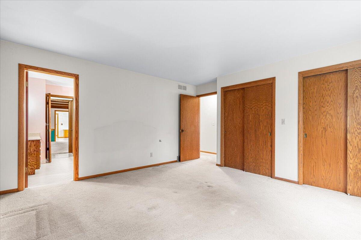 7525 North Redwood Road Glendale, WI 53209 - Photo 18 of 29 Primary Bedroom w/Two Closets