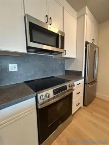 a balcony with wooden floor