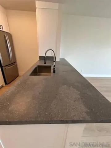 a kitchen that has a sink and a stove