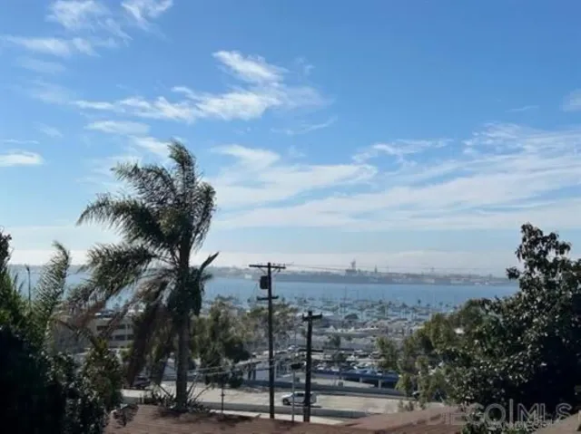 a kitchen with stainless steel appliances granite countertop a refrigerator and a stove