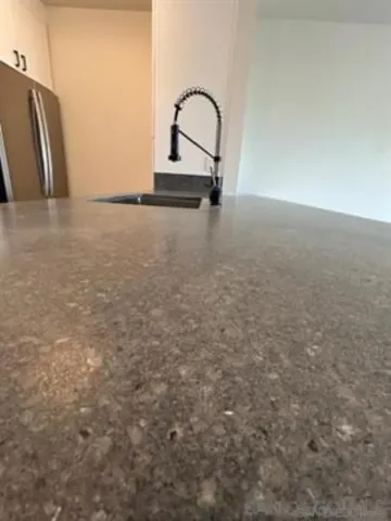 a view of an empty room and wooden floor