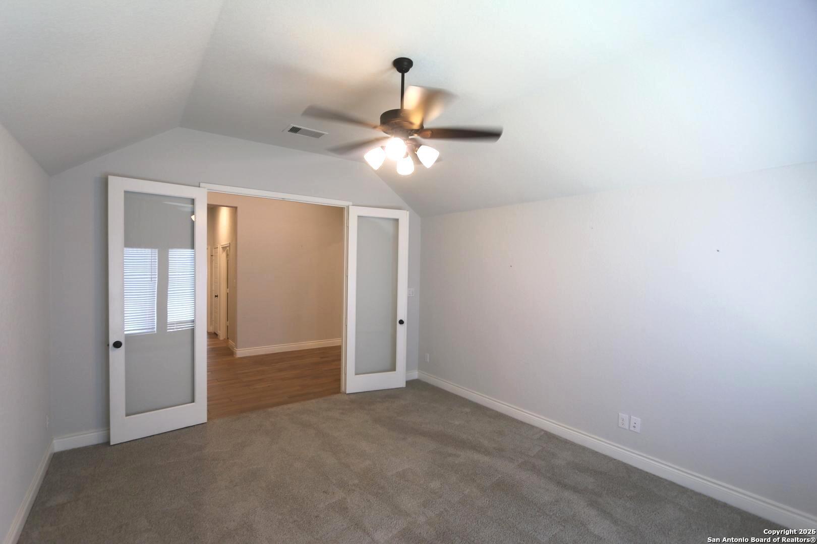 2965 Grove Way Seguin, TX 78155 - Photo 18 of 60 a view of a chandelier fan in a room