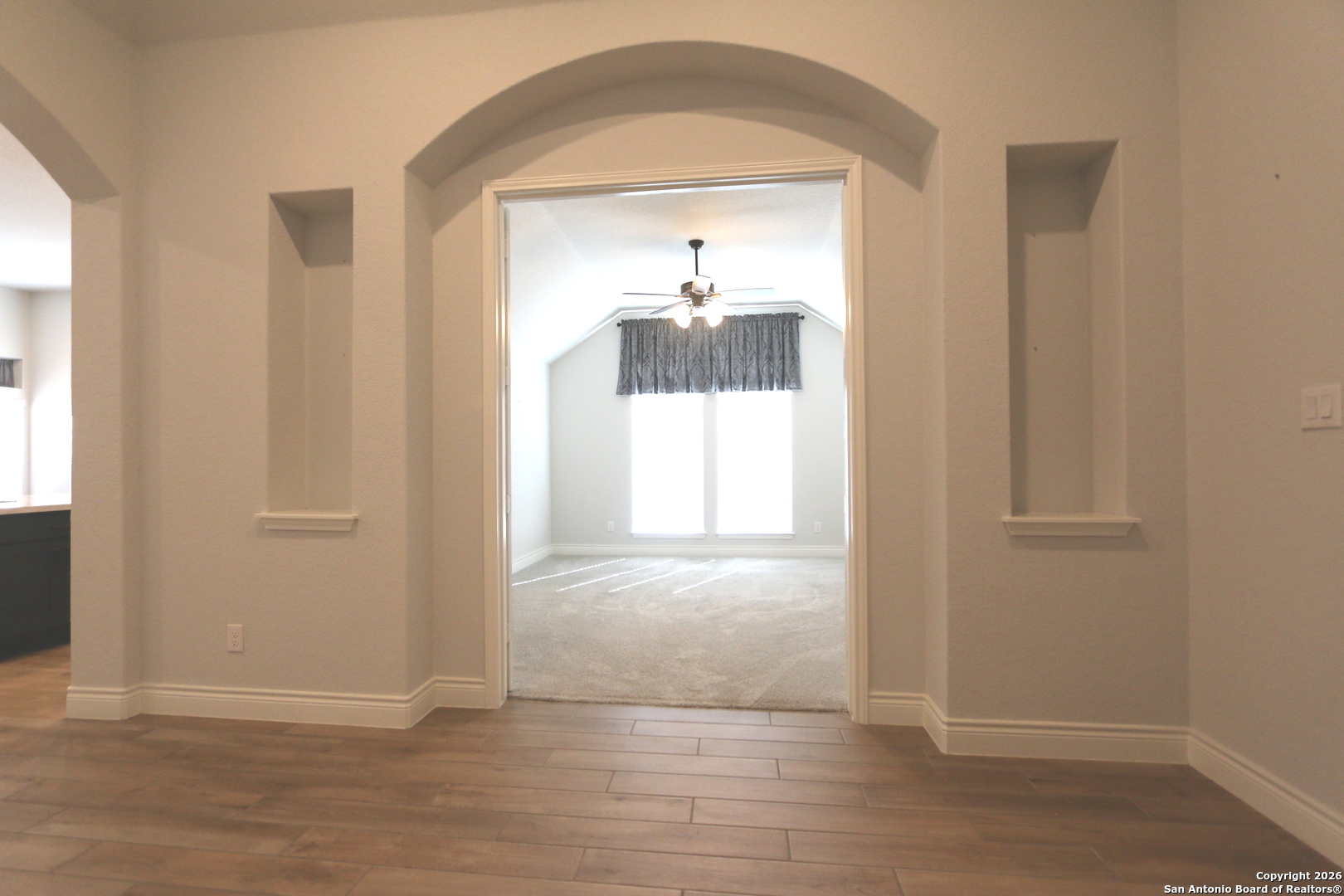2965 Grove Way Seguin, TX 78155 - Photo 19 of 60 wooden floor in an empty room with a window