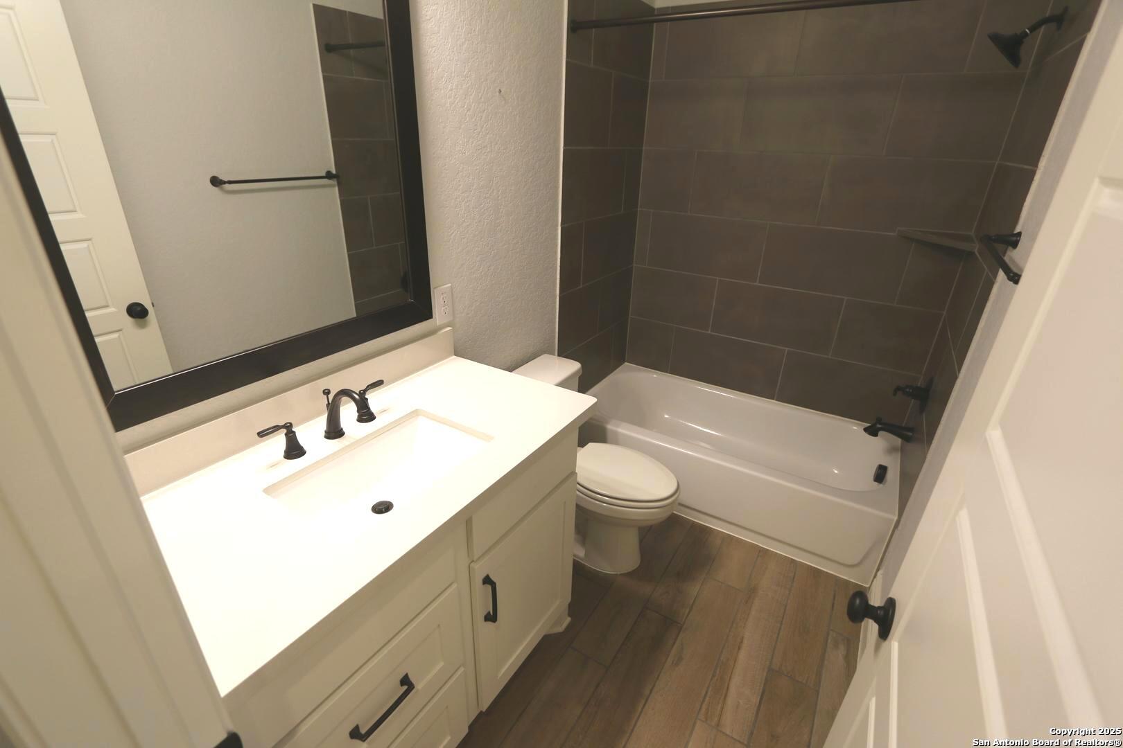 2965 Grove Way Seguin, TX 78155 - Photo 29 of 60 a bathroom with a sink toilet and shower