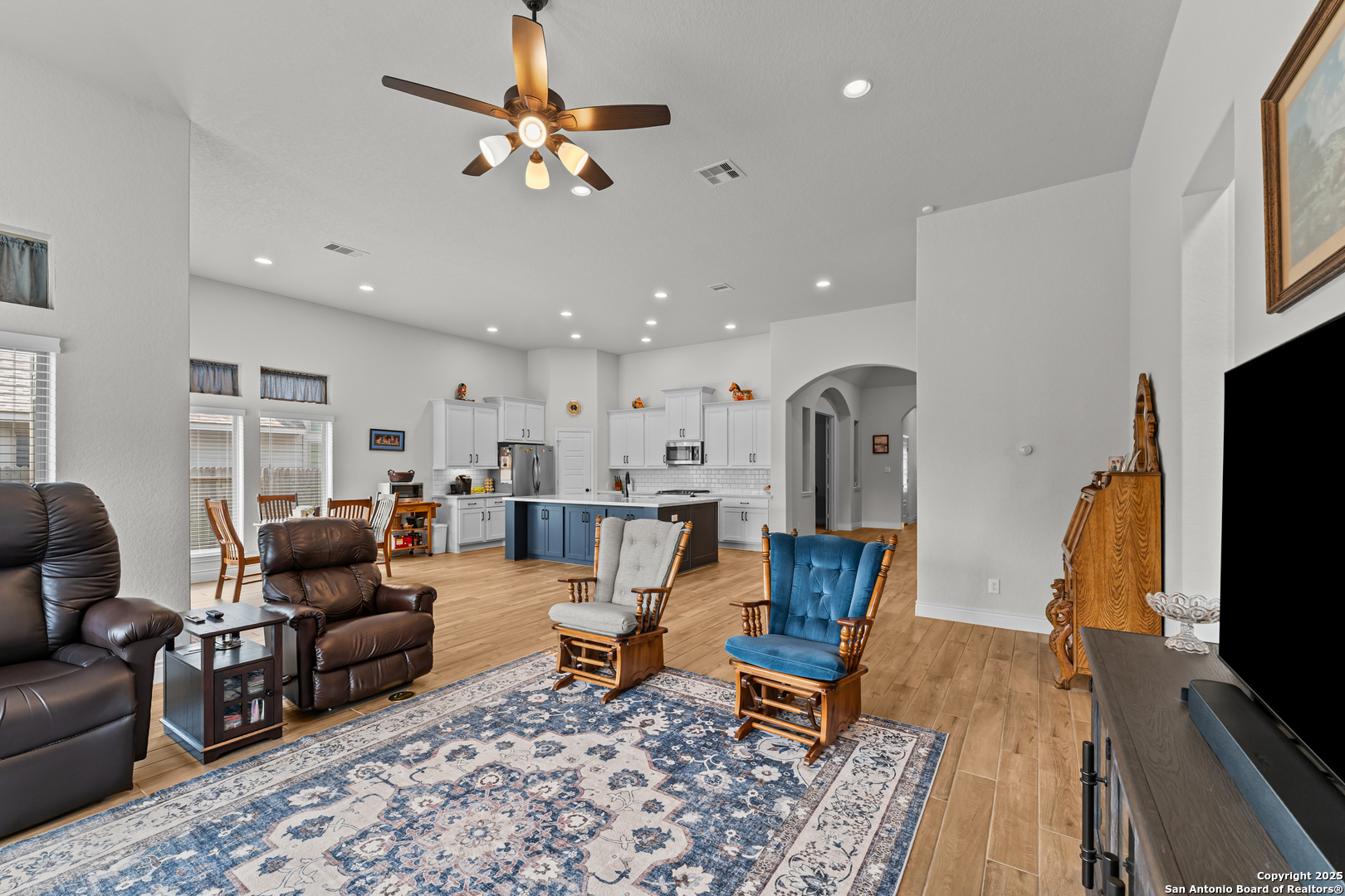 2965 Grove Way Seguin, TX 78155 - Photo 38 of 60 a living room with furniture a rug and a flat screen tv