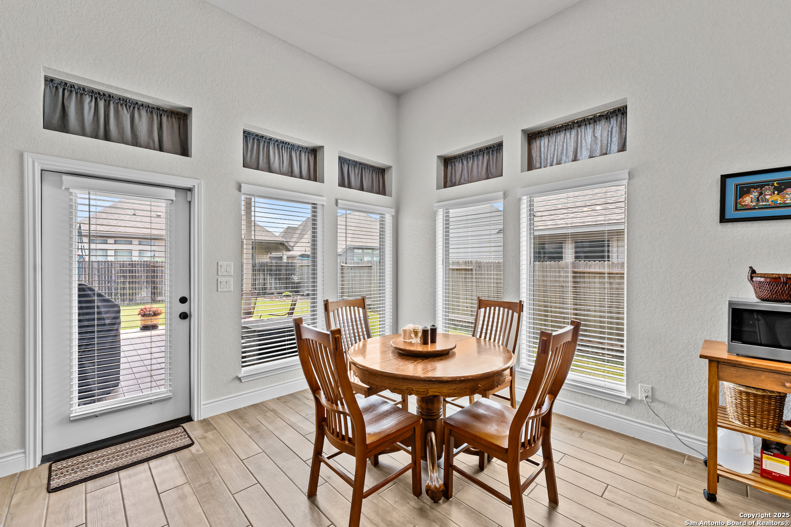 2965 Grove Way Seguin, TX 78155 - Photo 42 of 60 a view of a dining room with furniture and wooden floor