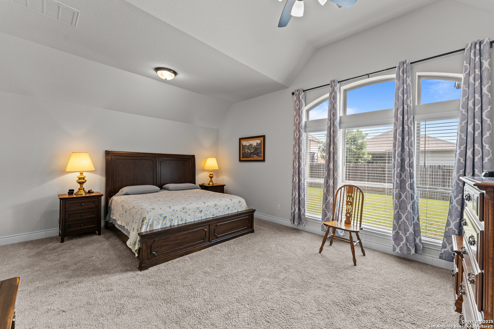 2965 Grove Way Seguin, TX 78155 - Photo 47 of 60 a bedroom with a bed and a chandelier