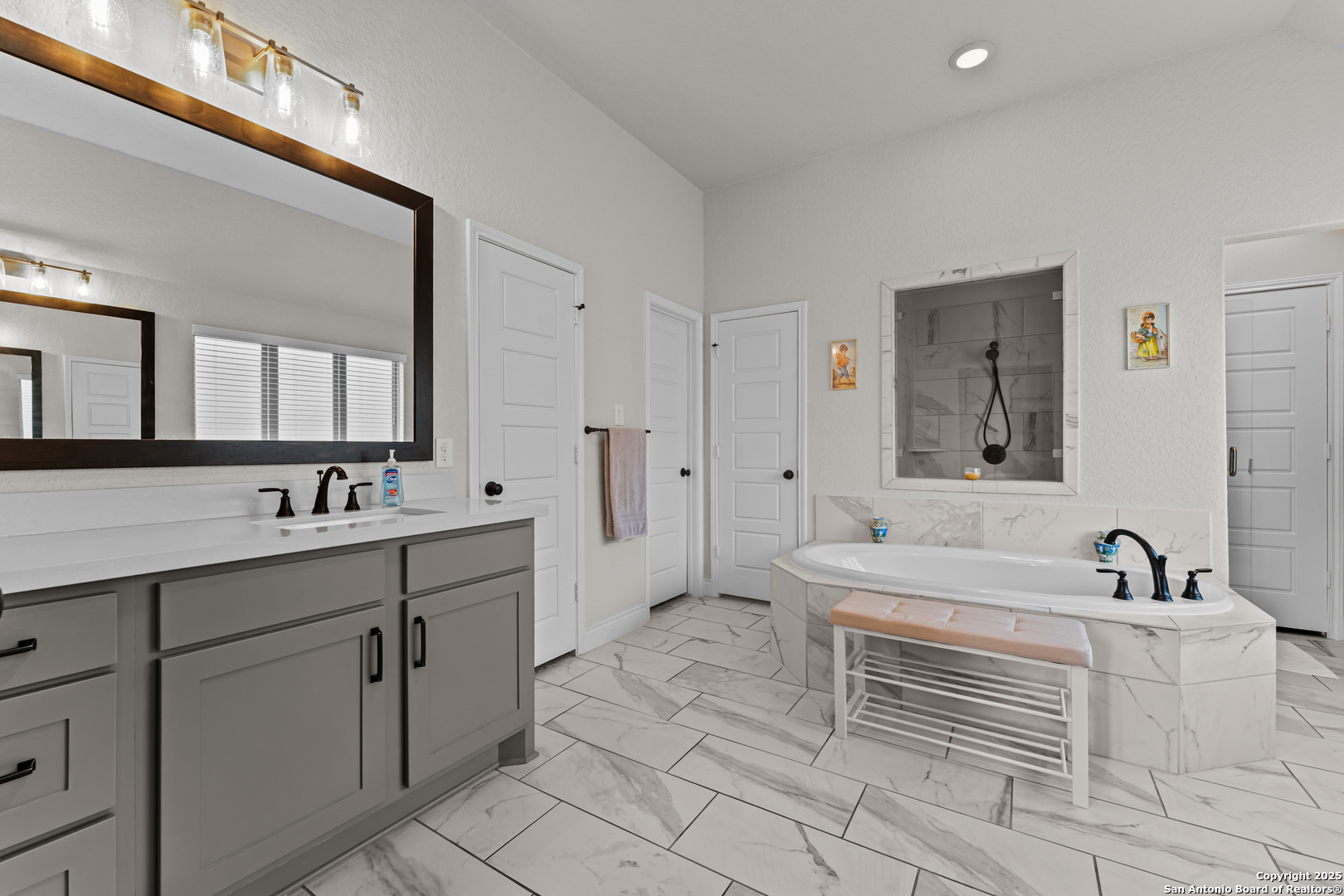 2965 Grove Way Seguin, TX 78155 - Photo 49 of 60 a spacious bathroom with a double vanity sink mirror and