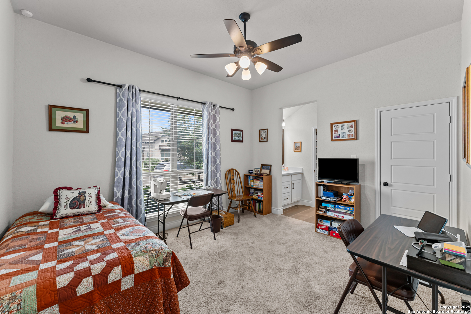 2965 Grove Way Seguin, TX 78155 - Photo 52 of 60 a bedroom with a bed desk and a window