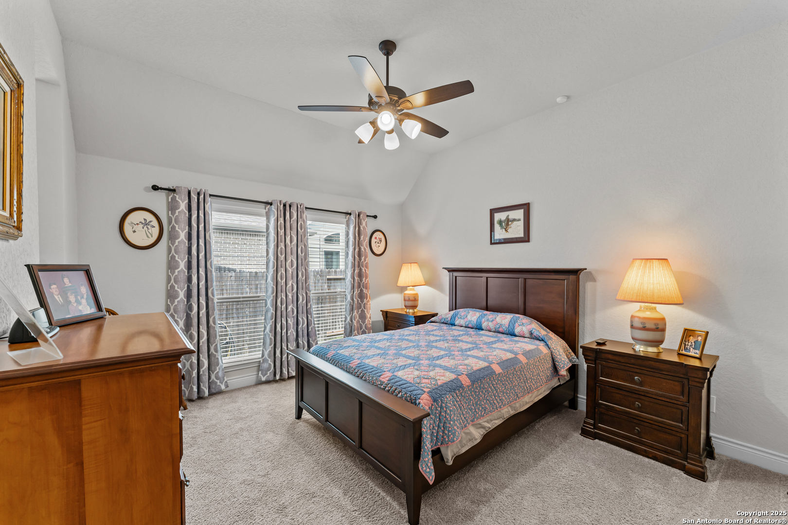 2965 Grove Way Seguin, TX 78155 - Photo 54 of 60 a bedroom with a bed and a chandelier