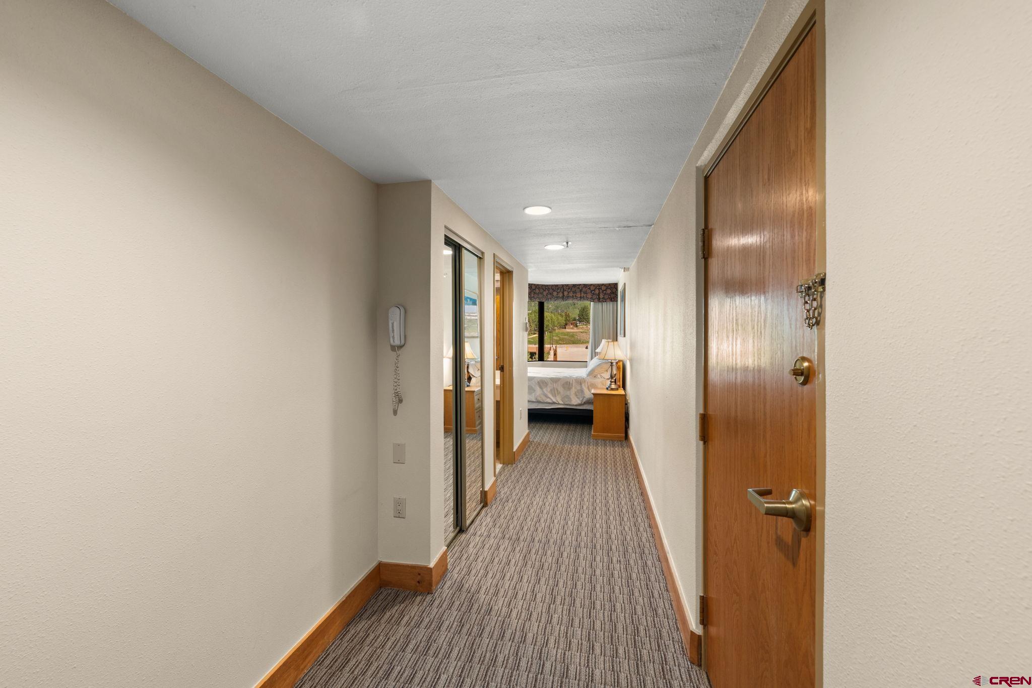 6 Emmons Road, Unit 452 & 454 Crested Butte, CO 81225 - Photo 11 of 38 a view of a hallway with a livingroom and a bathroom