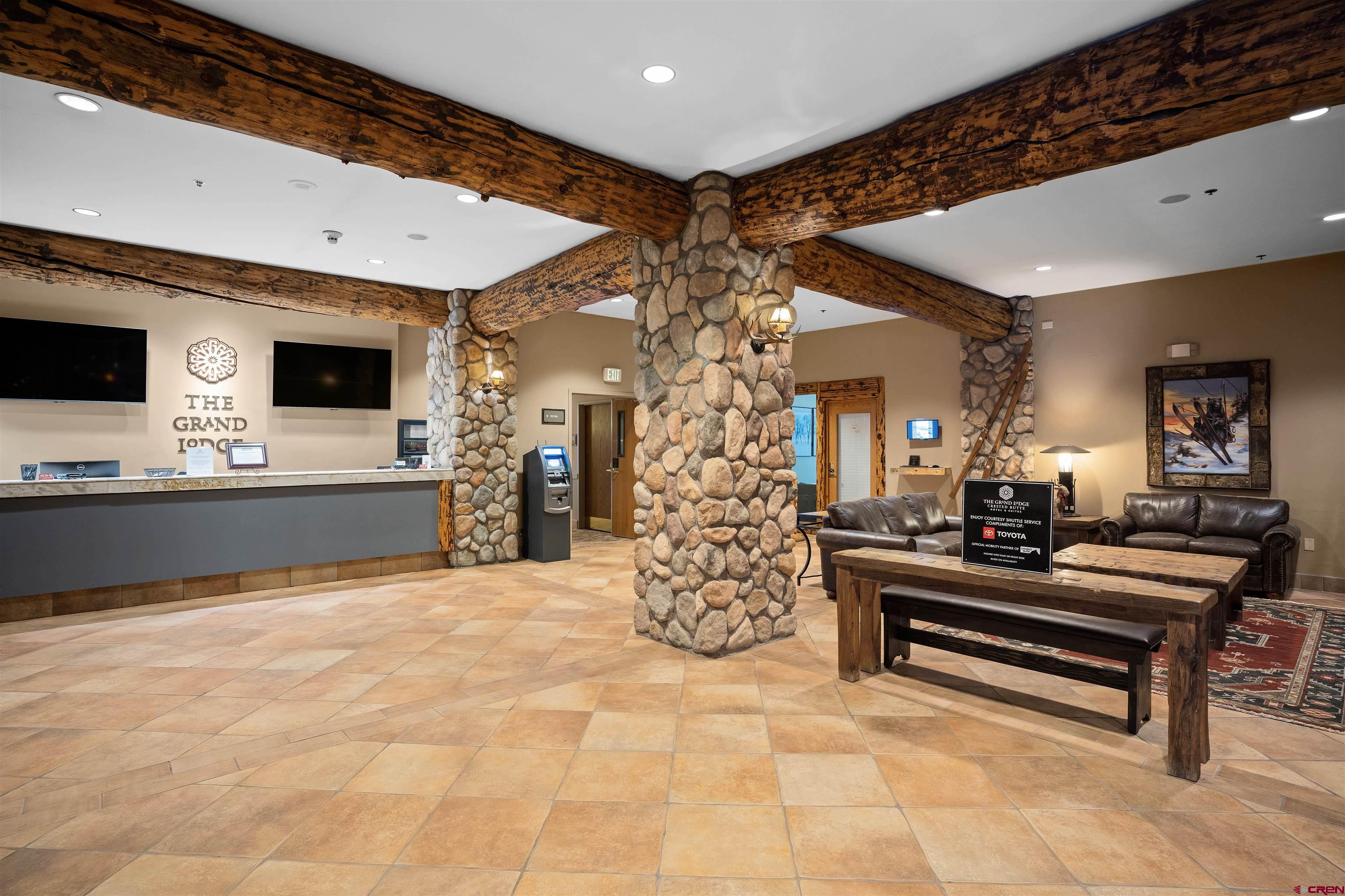 6 Emmons Road, Unit 452 & 454 Crested Butte, CO 81225 - Photo 30 of 38 a lobby with furniture and flat screen tv