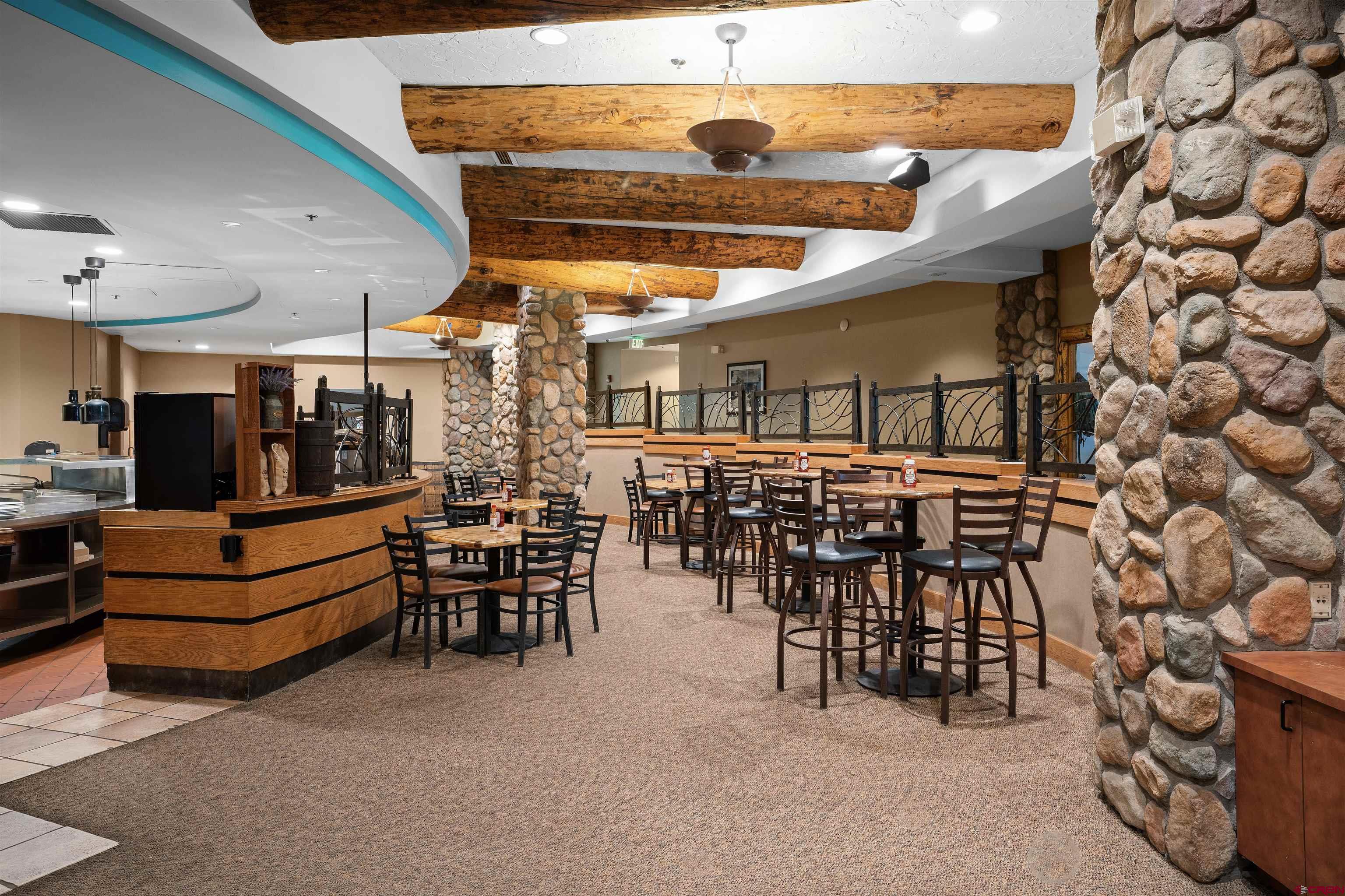 6 Emmons Road, Unit 452 & 454 Crested Butte, CO 81225 - Photo 34 of 38 a view of a chairs and tables in the patio