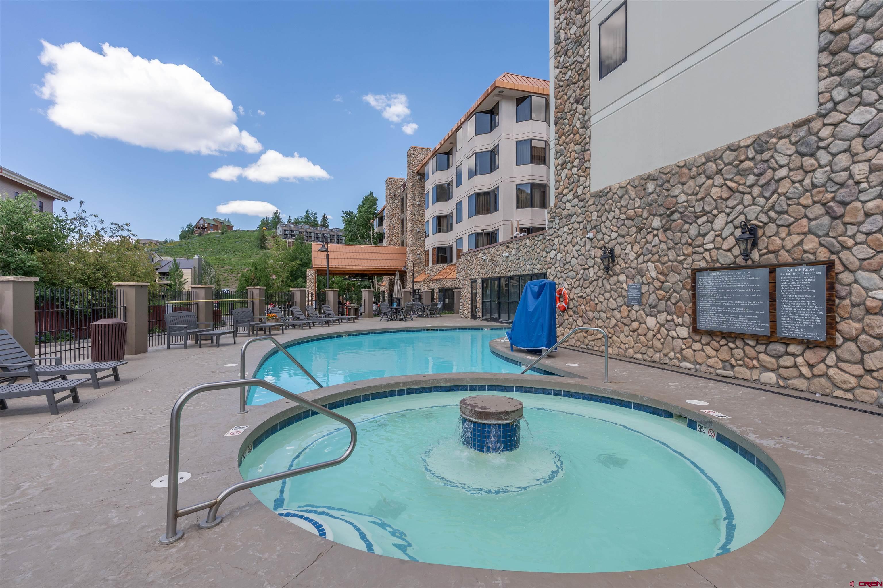 6 Emmons Road, Unit 452 & 454 Crested Butte, CO 81225 - Photo 37 of 38 a view of a swimming pool with a patio