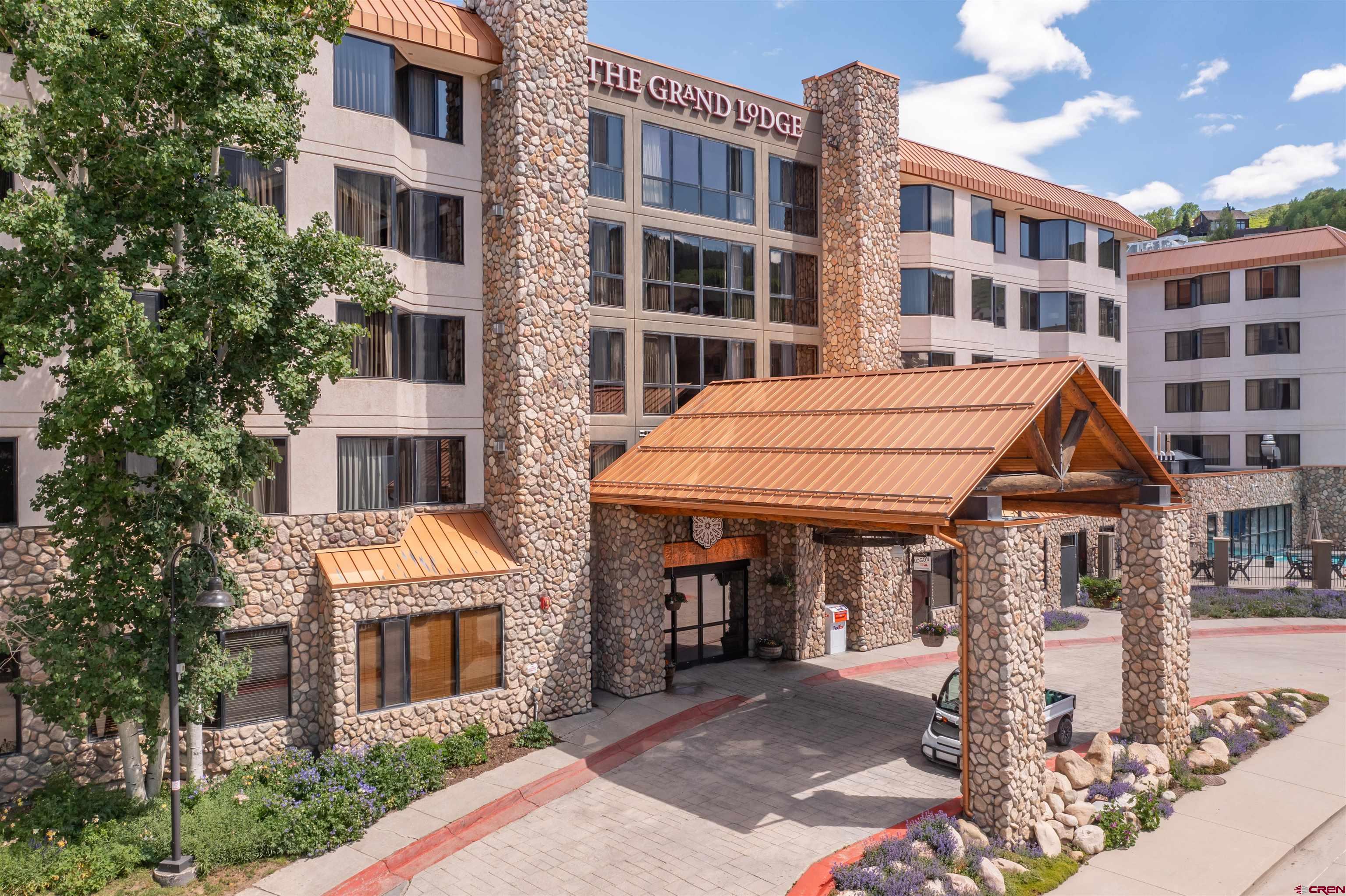 6 Emmons Road, Unit 452 & 454 Crested Butte, CO 81225 - Photo 38 of 38 a front view of a building with a garden
