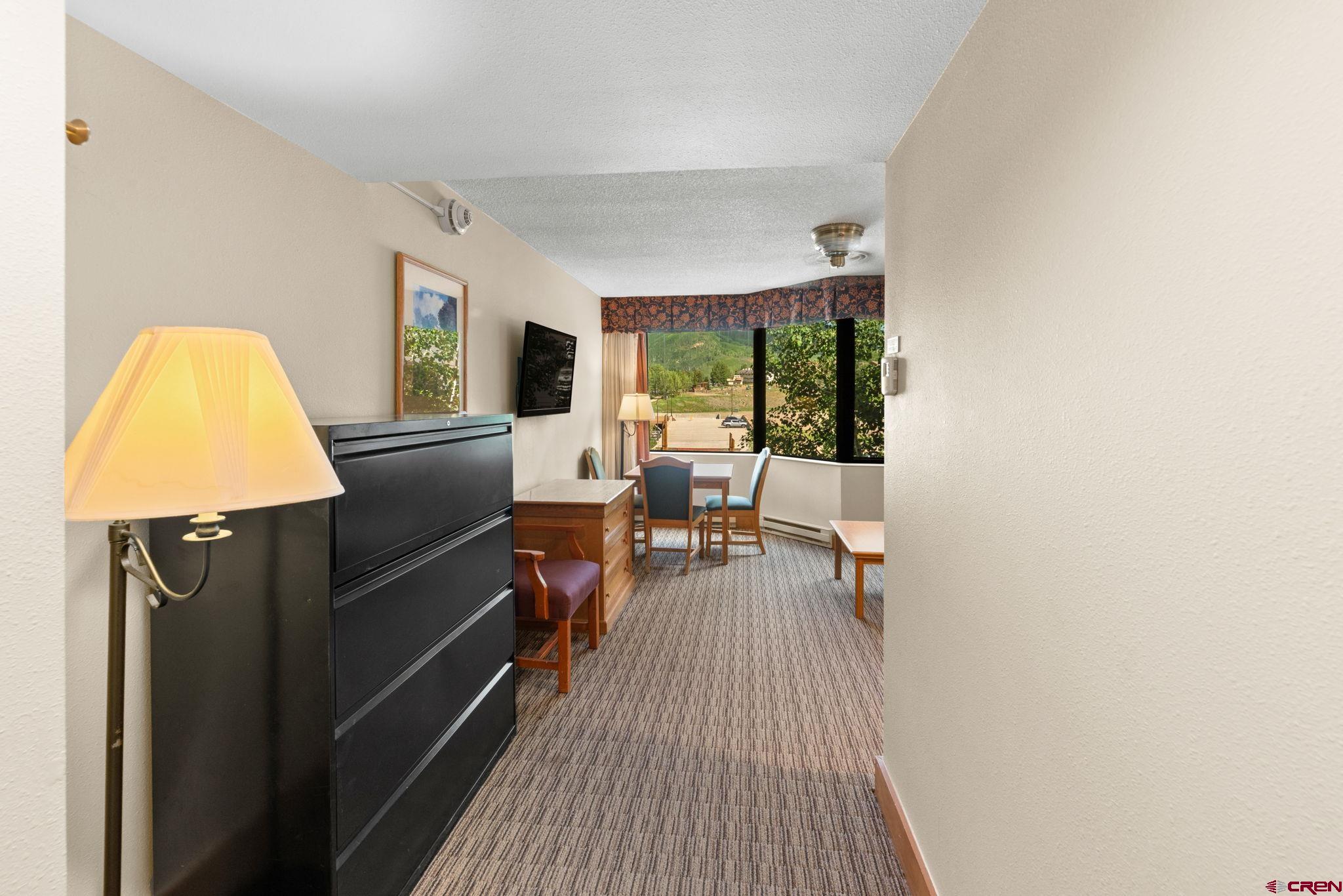 6 Emmons Road, Unit 452 & 454 Crested Butte, CO 81225 - Photo 8 of 38 a living room with furniture and a window