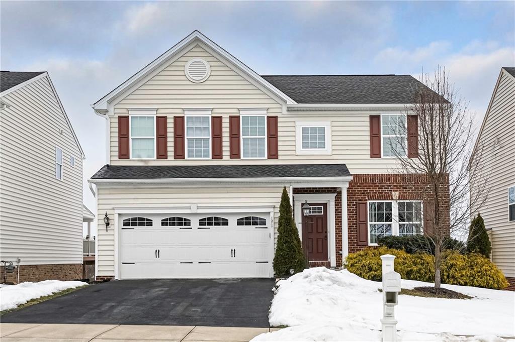 171 Cimarron Drive Moon Township, PA 15108 - Photo 1 of 25 a front view of a house with a yard