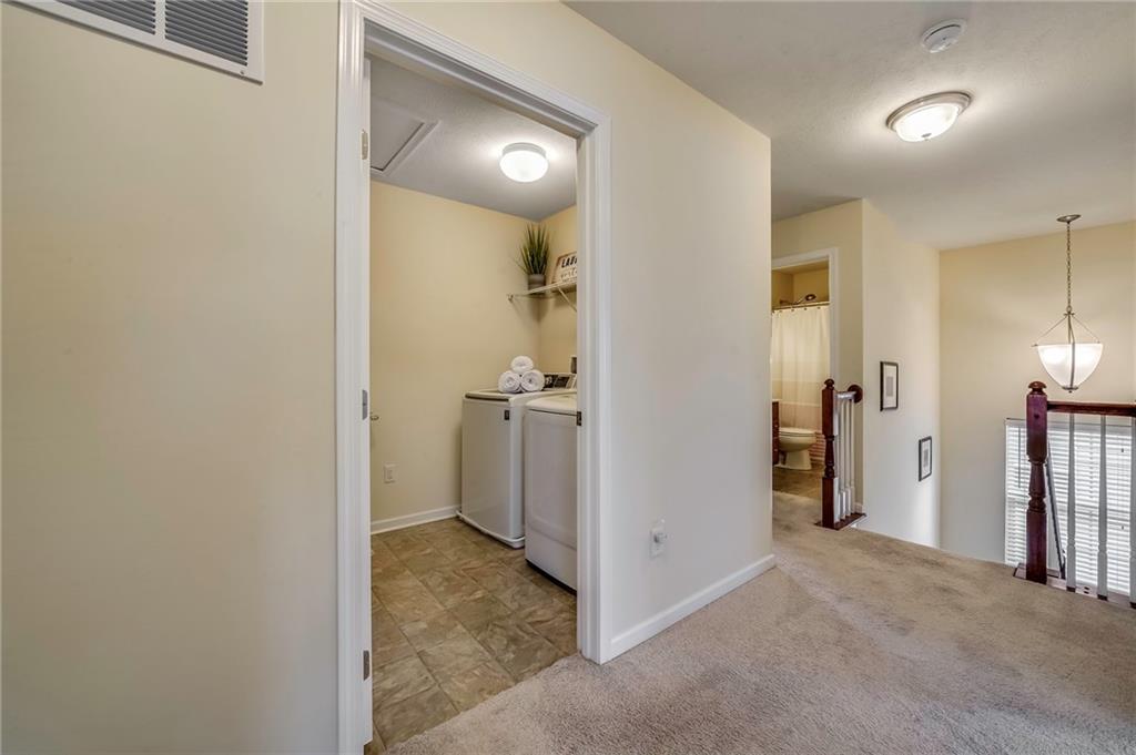 171 Cimarron Drive Moon Township, PA 15108 - Photo 15 of 25 a view of a hallway with a room and a bathroom
