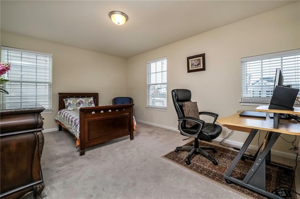 171 Cimarron Drive Moon Township, PA 15108 - Photo 17 of 25 a bedroom with bed computer on desk and a window