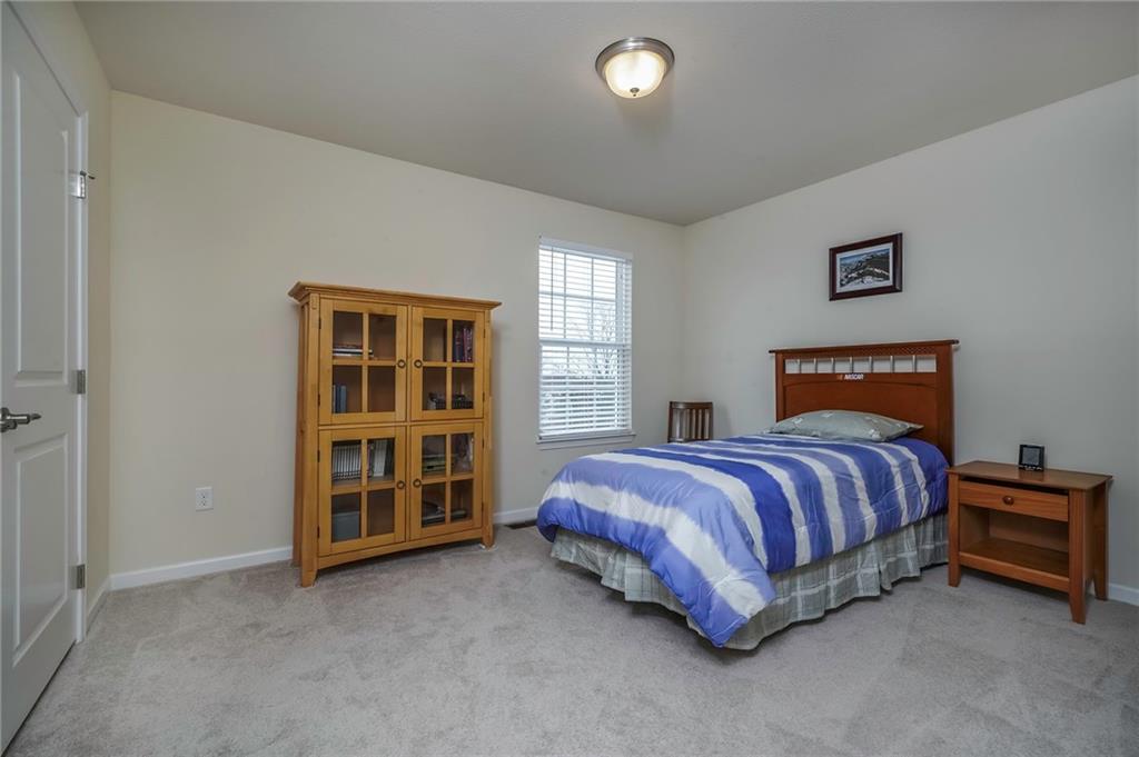 171 Cimarron Drive Moon Township, PA 15108 - Photo 18 of 25 a spacious bedroom with a bed and a window