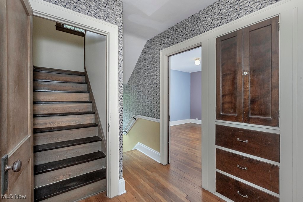 2602 Exeter Road Cleveland, OH 44118 - Photo 32 of 40 Landing with built in linen storage and stairs leading to the third floor.