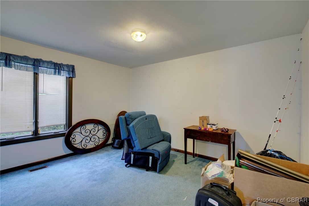 2488 Winfred Road Hayes, VA 23072 - Photo 19 of 25 Living area featuring light carpet
