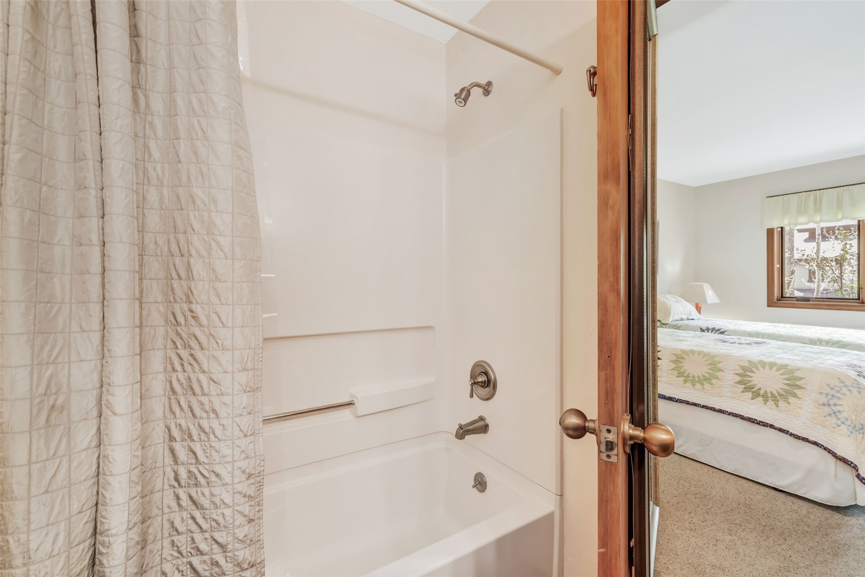 1675 Ranch Road, Unit 411 Steamboat Springs, CO 80487 - Photo 34 of 48 Bathroom with shower / bath combo with shower curtain