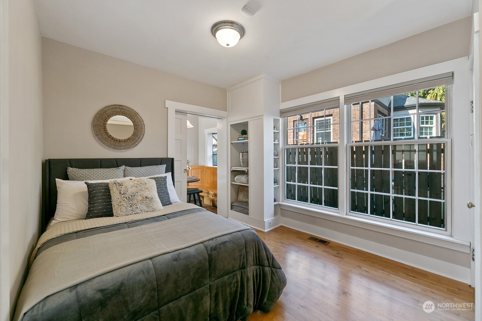 8053 12th Avenue Northeast Seattle, WA 98115 - Photo 13 of 27 a bedroom with a large bed and a large window