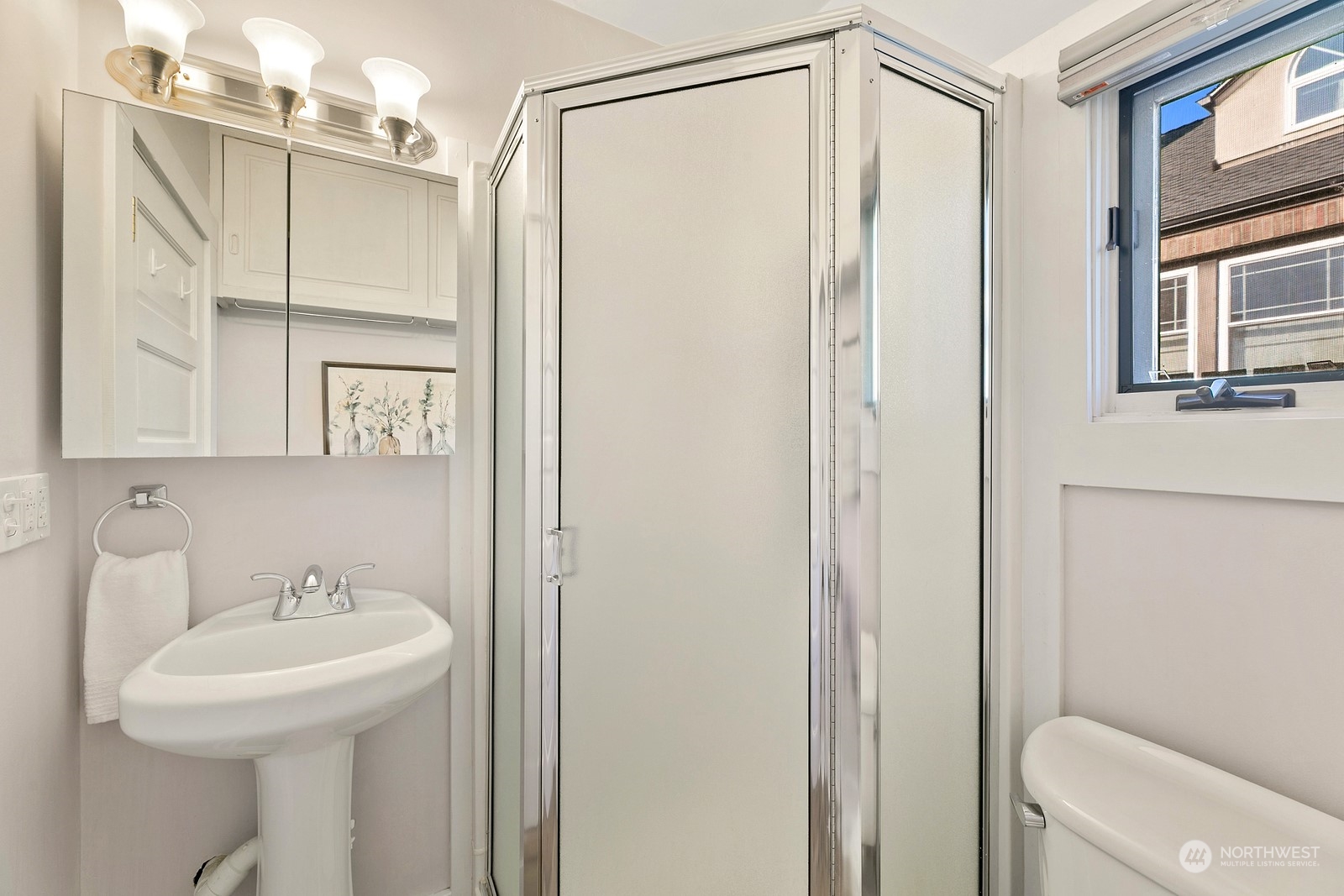 8053 12th Avenue Northeast Seattle, WA 98115 - Photo 15 of 27 a bathroom with a sink a toilet and shower