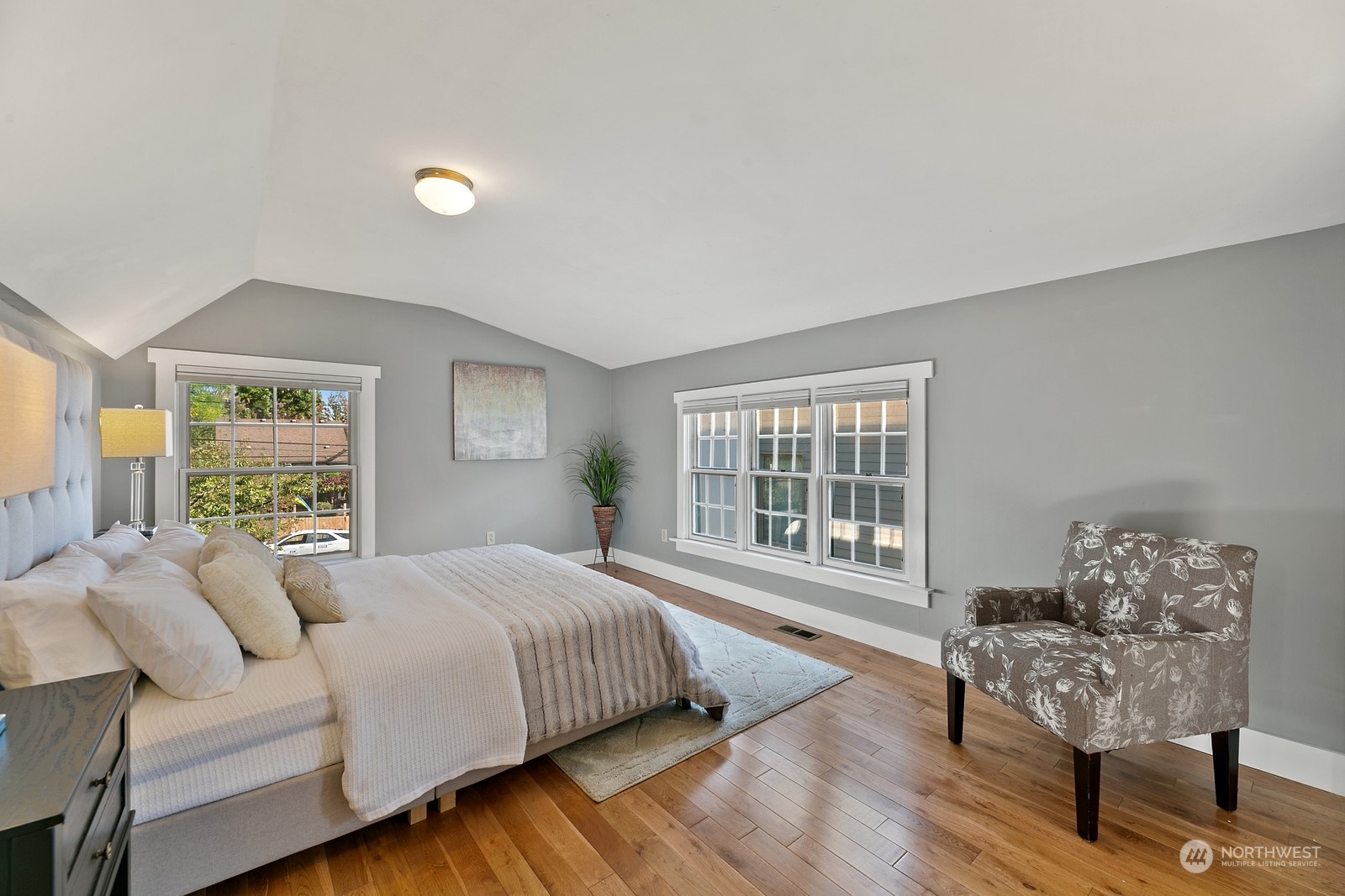 8053 12th Avenue Northeast Seattle, WA 98115 - Photo 17 of 27 a bedroom with a bed and a large window