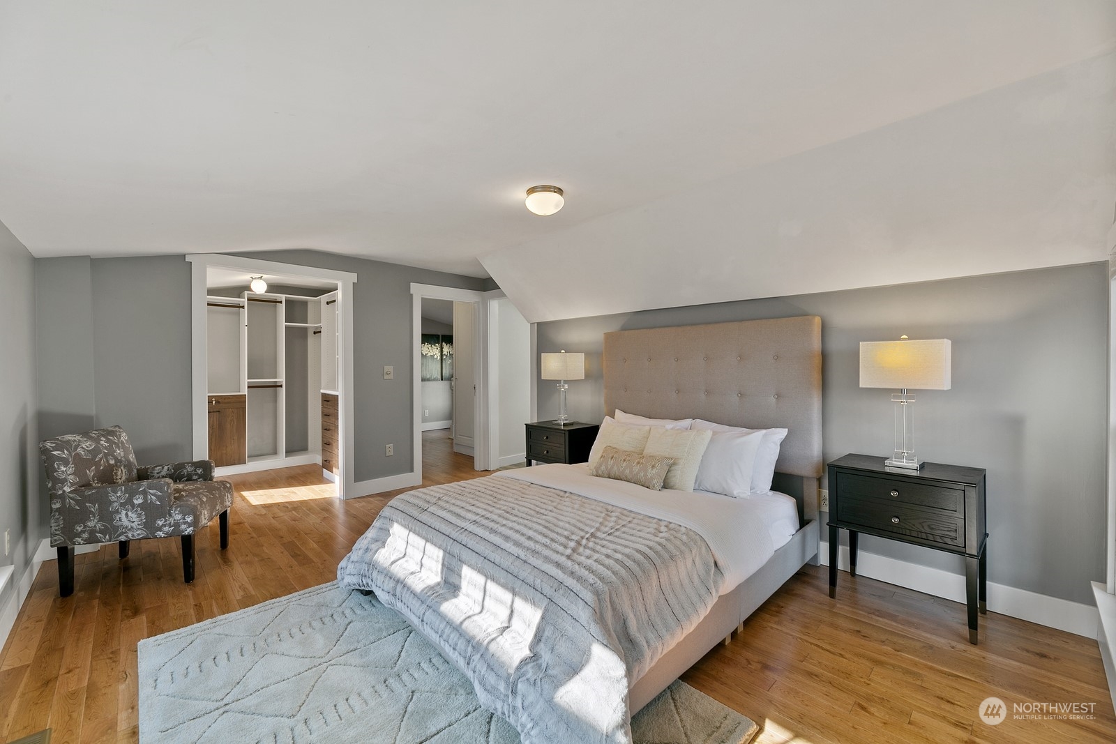 8053 12th Avenue Northeast Seattle, WA 98115 - Photo 18 of 27 a bedroom with a large bed and a potted plant