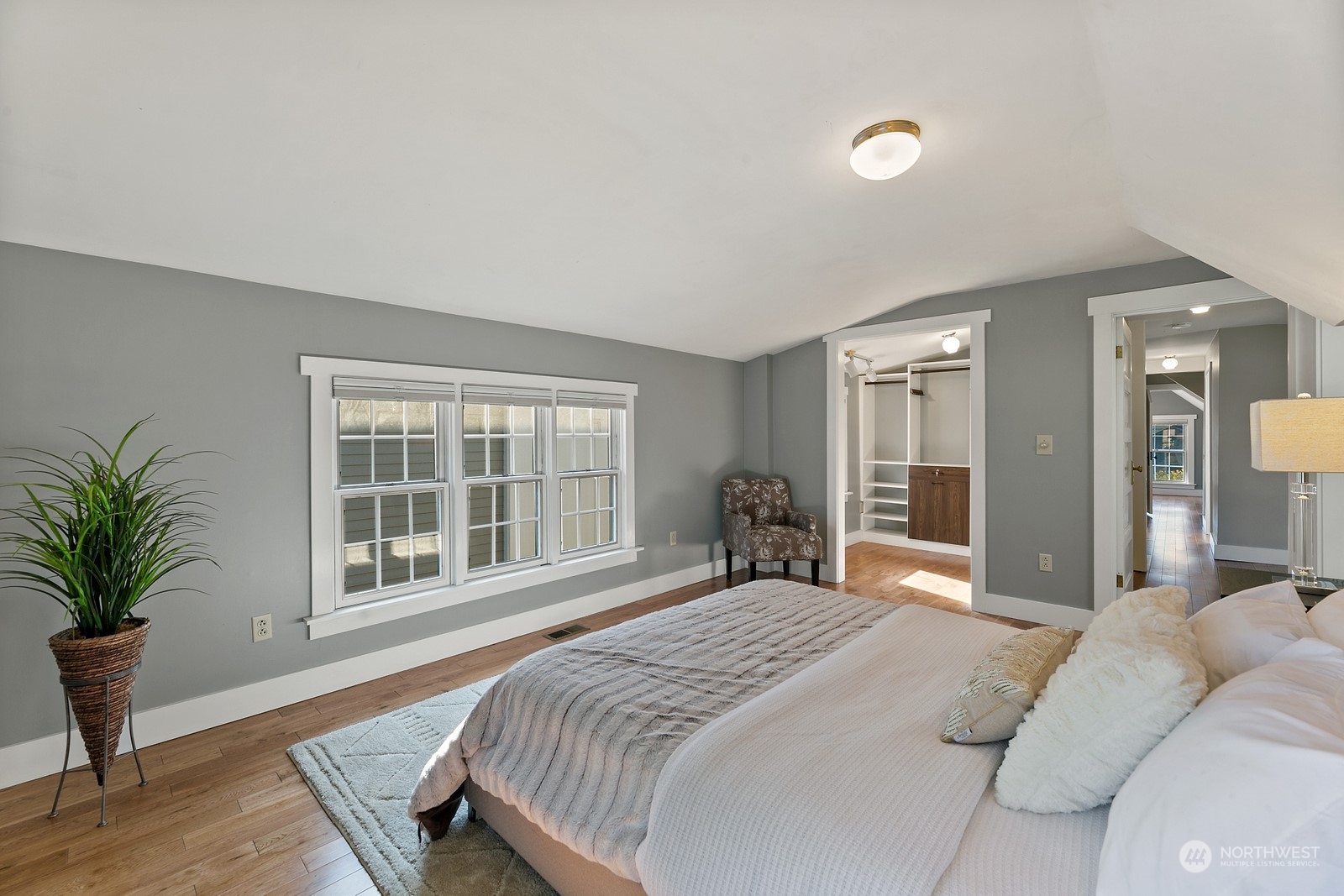 8053 12th Avenue Northeast Seattle, WA 98115 - Photo 19 of 27 a bedroom with a large bed and a large window