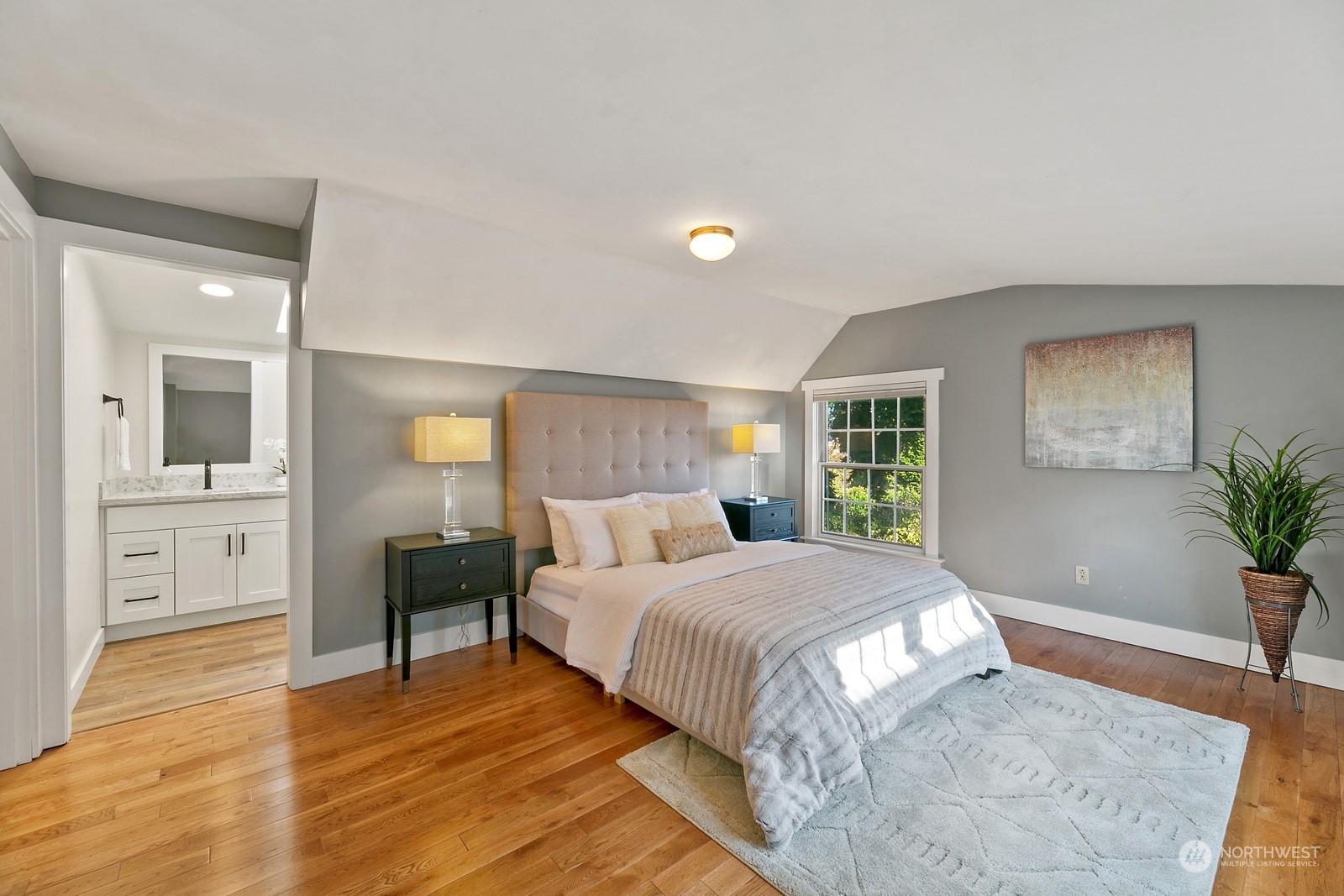 8053 12th Avenue Northeast Seattle, WA 98115 - Photo 20 of 27 a bedroom with a large bed and a dresser