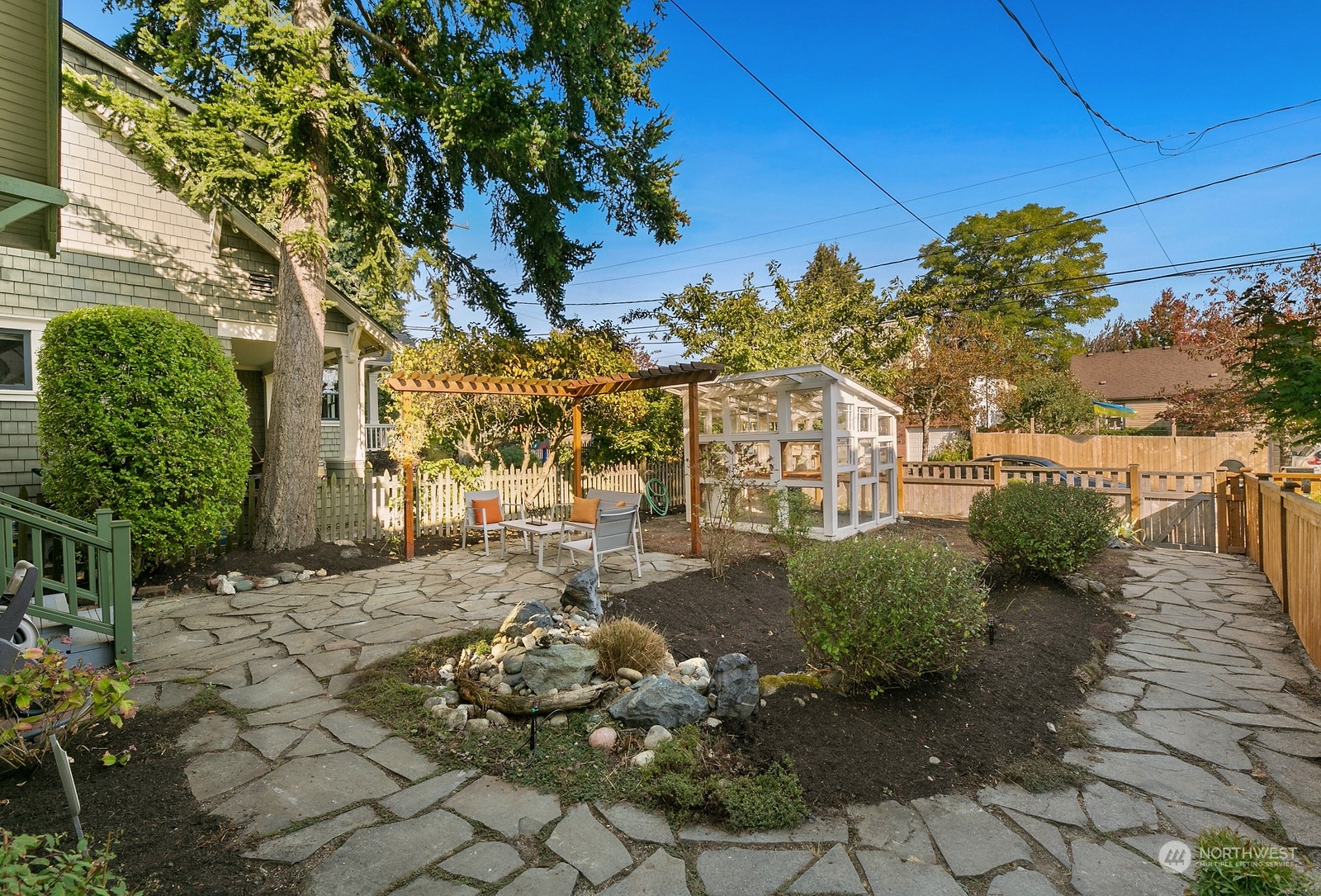 8053 12th Avenue Northeast Seattle, WA 98115 - Photo 2 of 27 a backyard of a house with lots of green space