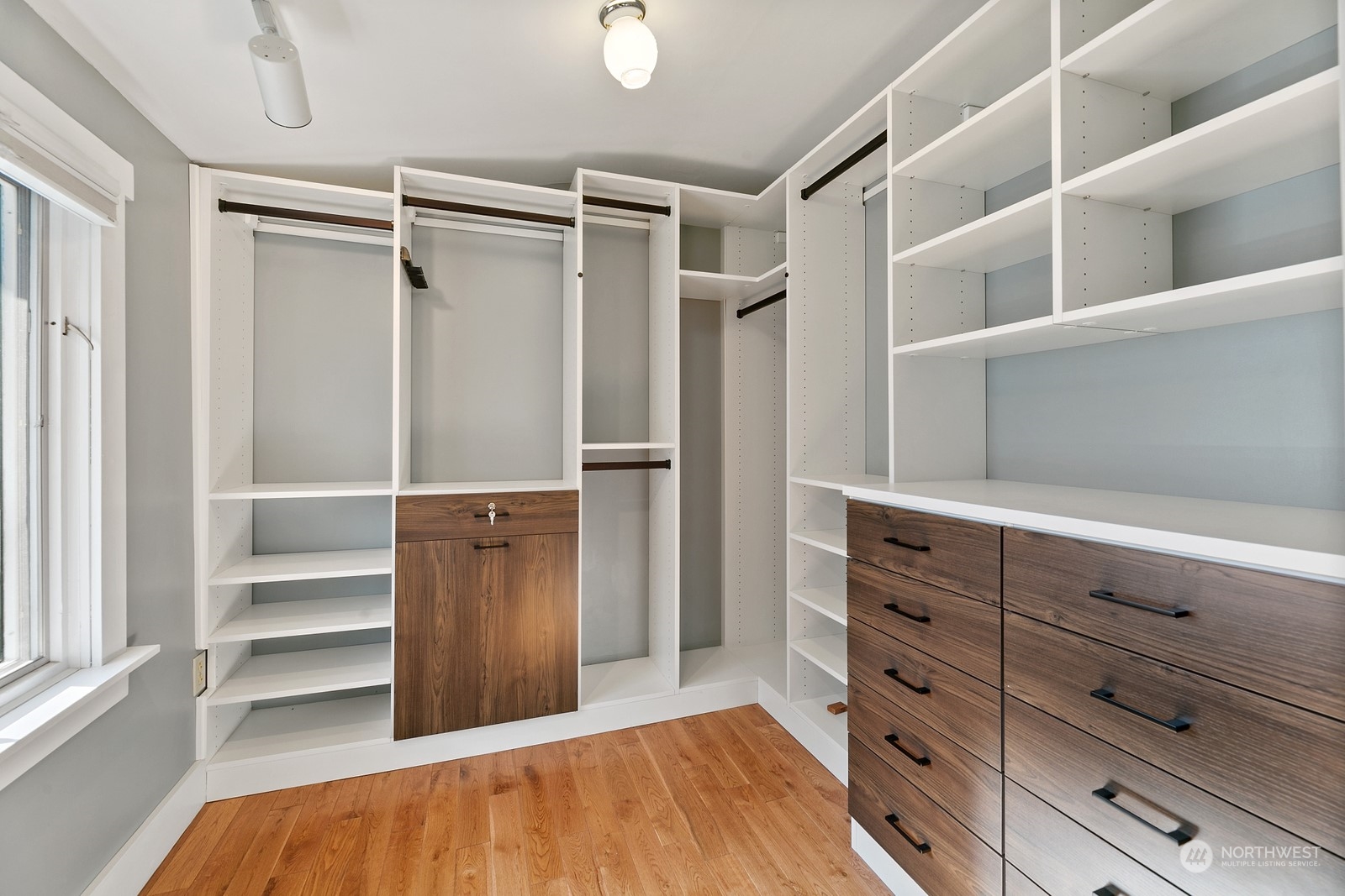 8053 12th Avenue Northeast Seattle, WA 98115 - Photo 22 of 27 a view of walk in closet with empty racks