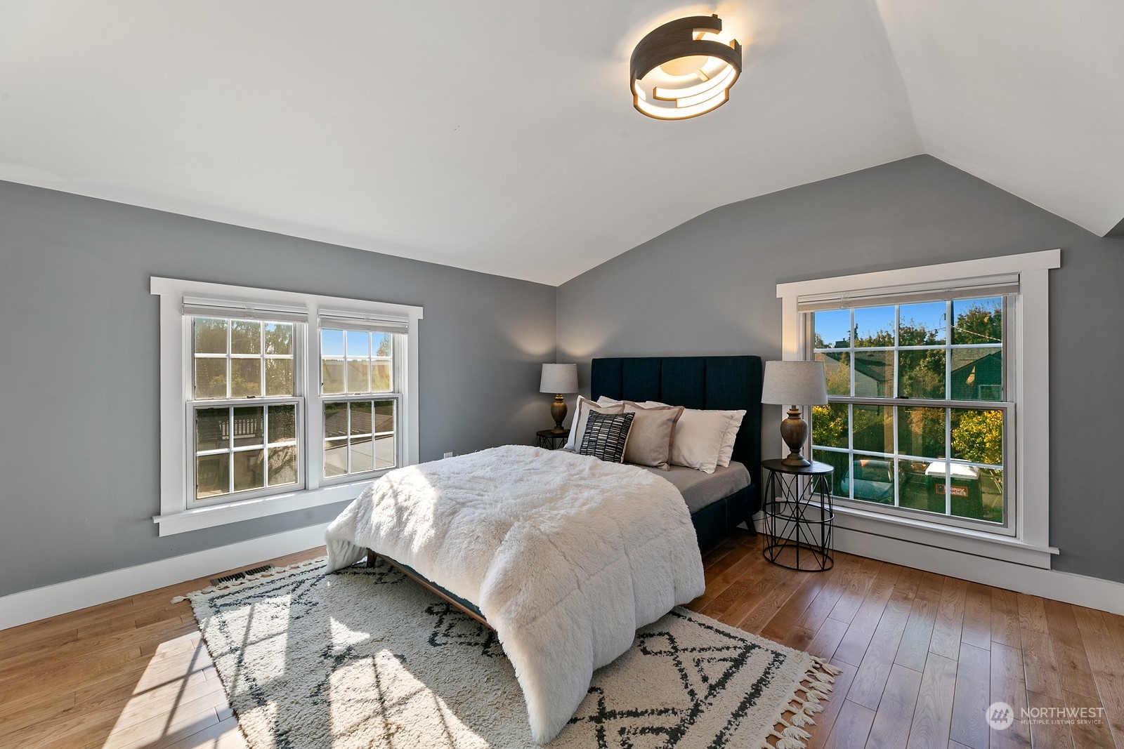8053 12th Avenue Northeast Seattle, WA 98115 - Photo 23 of 27 a bedroom with a bed and a window