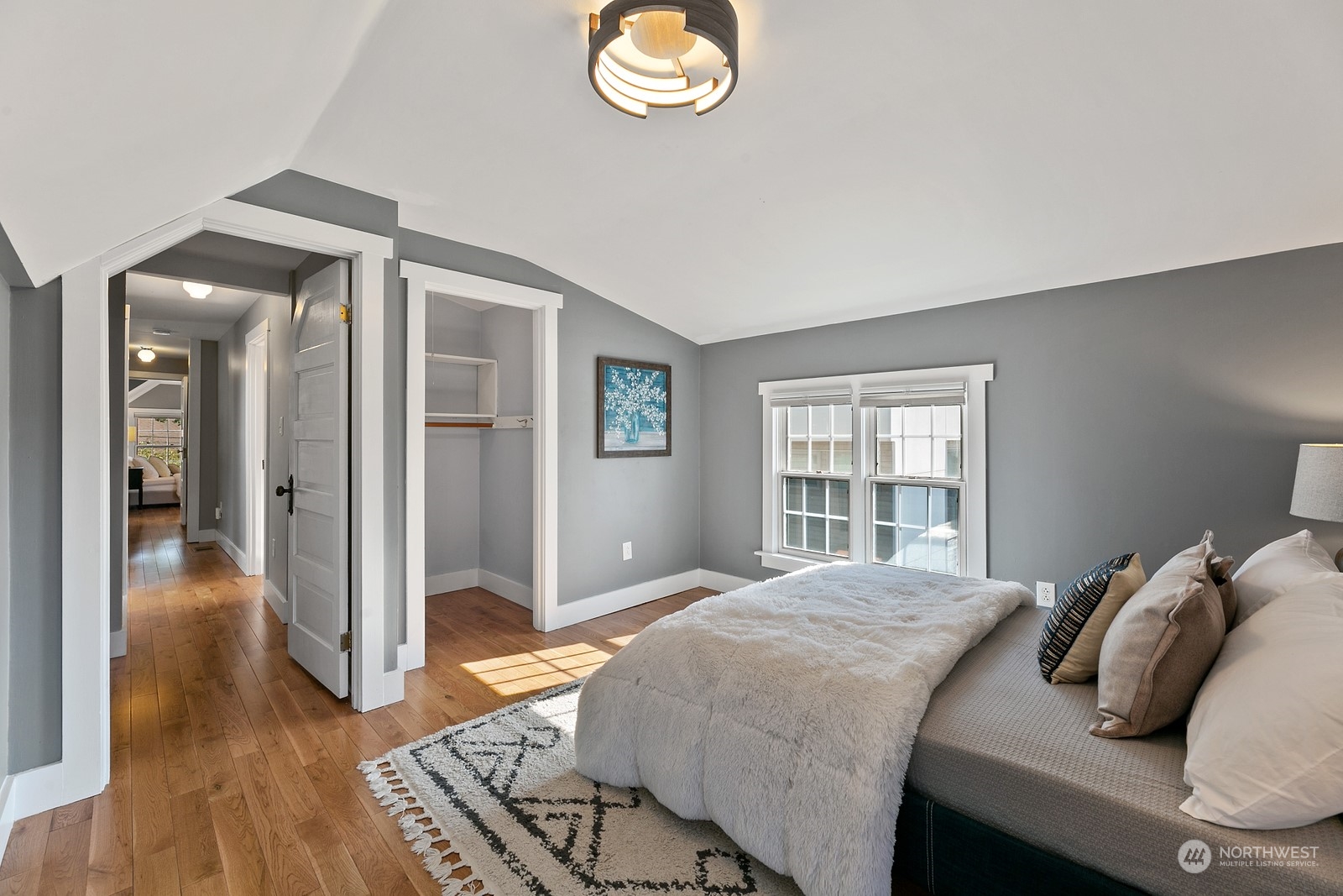 8053 12th Avenue Northeast Seattle, WA 98115 - Photo 24 of 27 a bedroom with a bed and a window