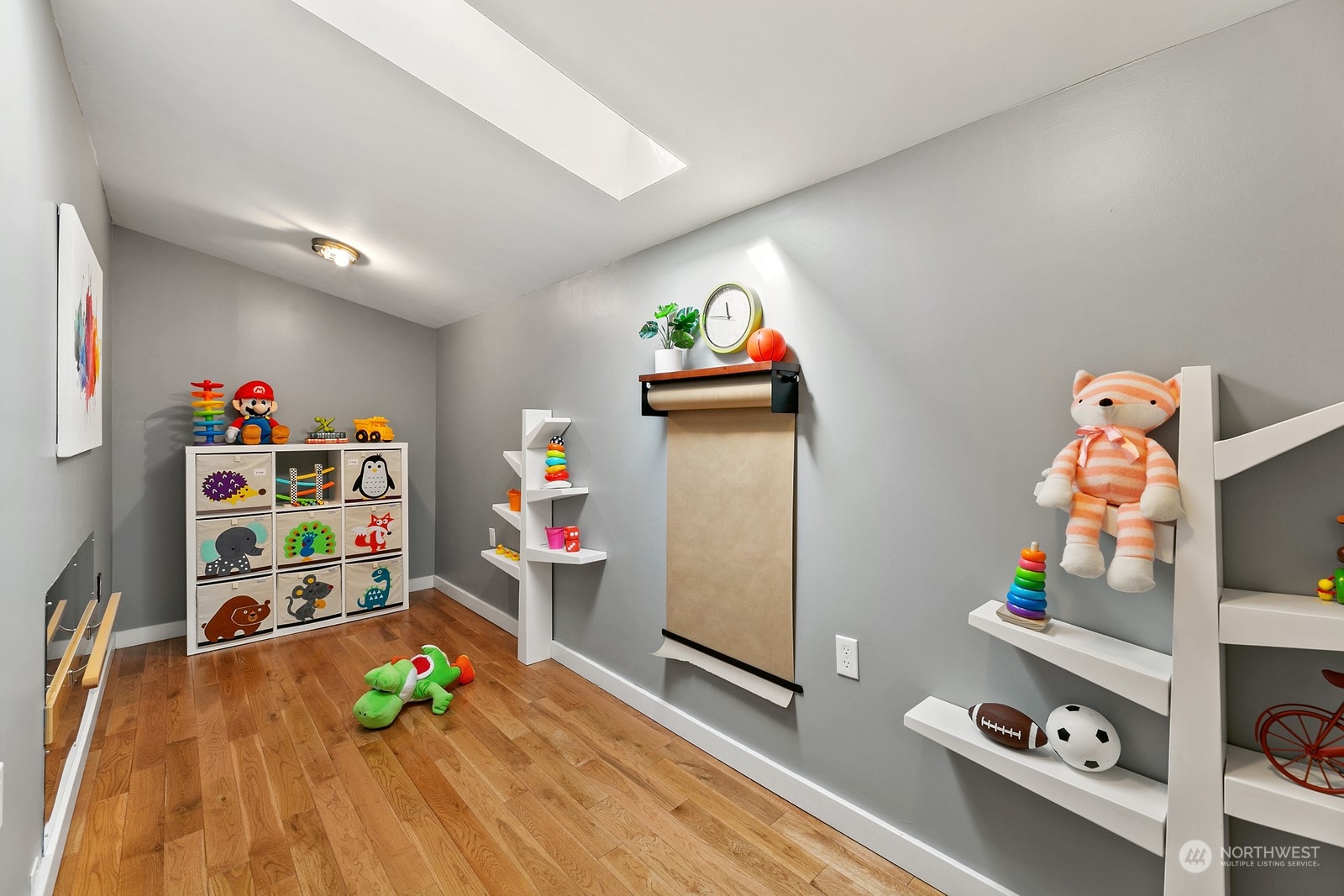8053 12th Avenue Northeast Seattle, WA 98115 - Photo 25 of 27 a room with toys and wooden floor