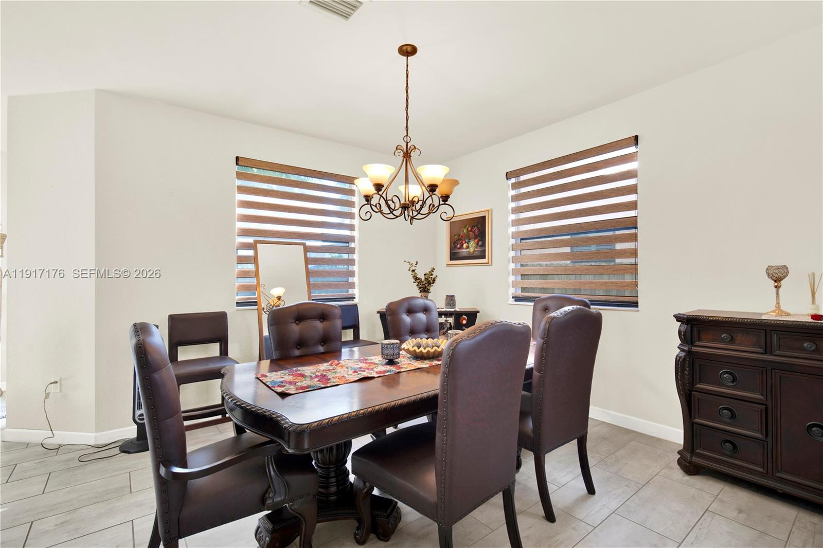 217 Northeast 23rd Terrace Homestead, FL 33033 - Photo 13 of 59 a view of a dining room with furniture and window