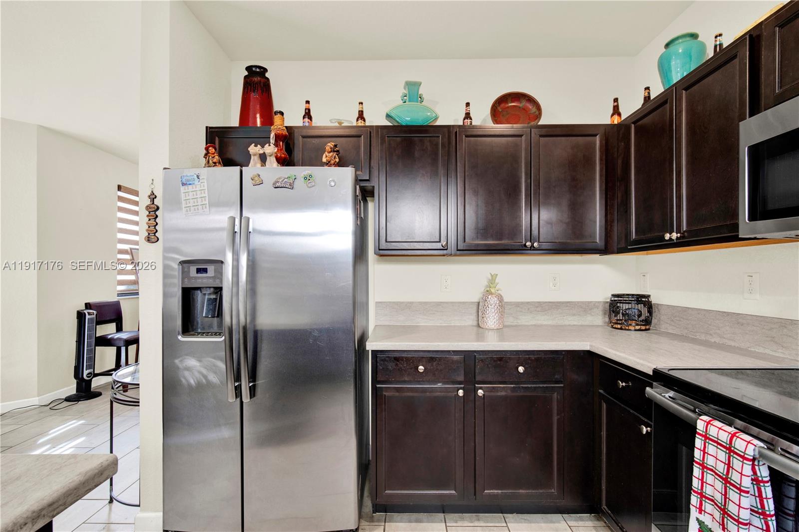 217 Northeast 23rd Terrace Homestead, FL 33033 - Photo 20 of 59 a kitchen with stainless steel appliances granite countertop a refrigerator a stove and a sink
