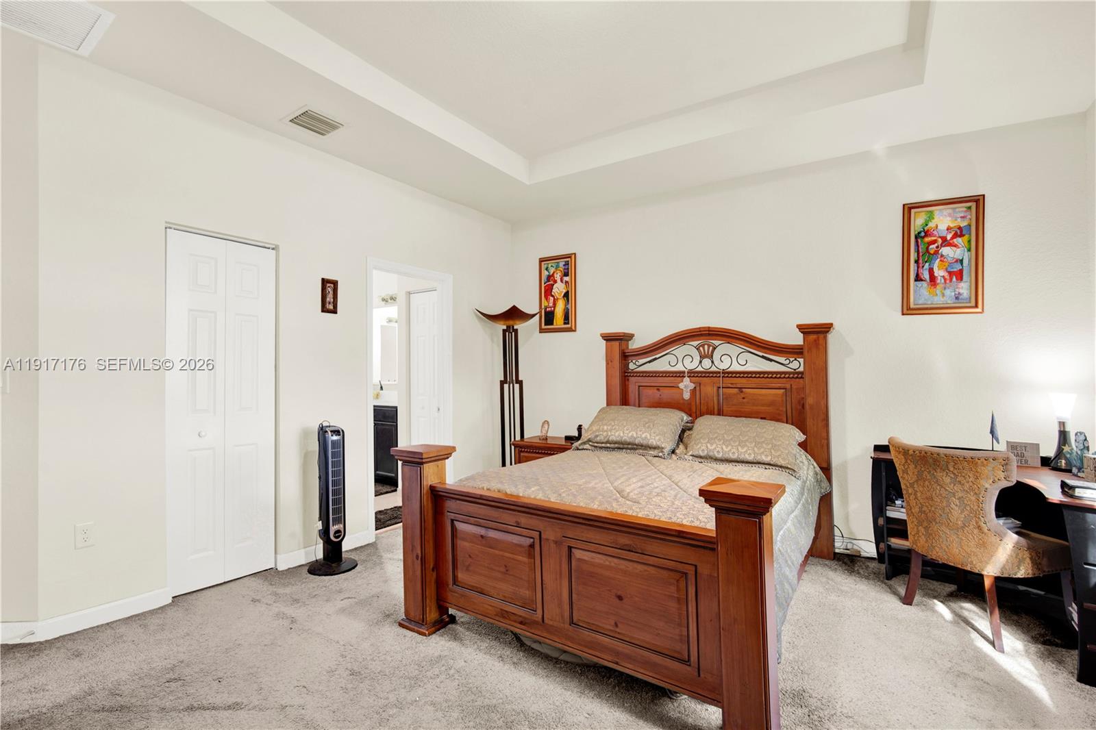 217 Northeast 23rd Terrace Homestead, FL 33033 - Photo 22 of 59 a bedroom with a bed and a table in it